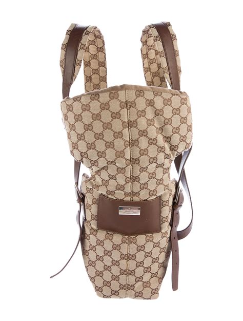 louis vuitton baby carrier.